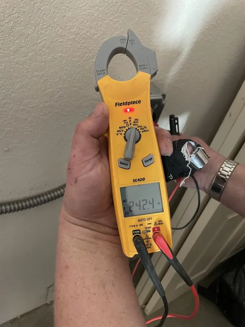 Voltage testing with clamp meter during Ceiling Fan Installation in Rose Hill